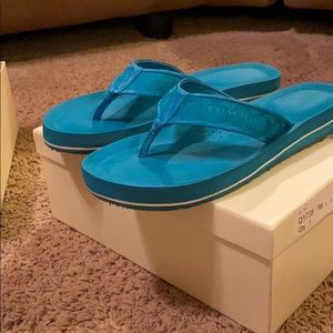 Fun Coach Signature flip flops.